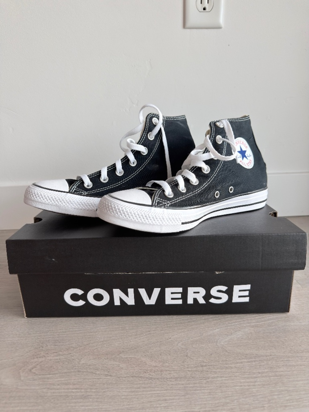 Classic Converse Chuck Taylor All Star high tops in black canvas. Size US 6M/8W